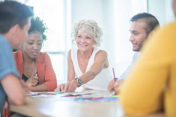 istock Happy executive leads a meeting 1094245260