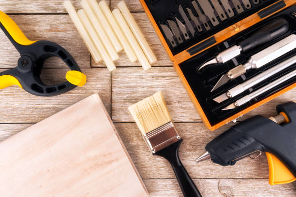 istock Set of DIY tools on a white wooden plank, directly above 1094248346