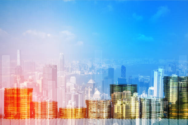 istock Double exposure of coin stack with financial graph over city and office building background, business and financial concept. 1094252392
