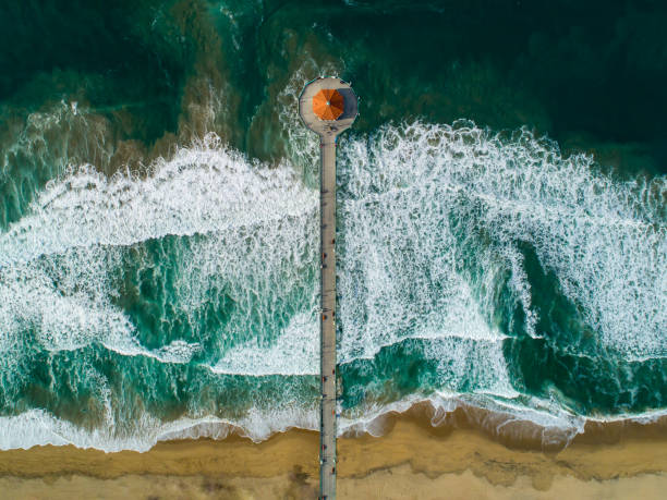Manhattan Beach California Pier looking straight down Aerial view of Manhattan Beach Pier los angeles aerial stock pictures, royalty-free photos & images