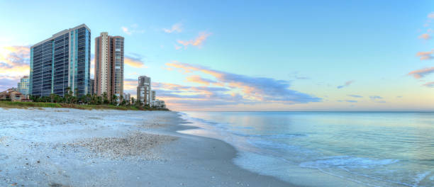 Sunrise over North Gulf Shore Beach along the coastline of Naples, Florida