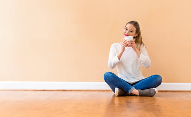 istock Young woman drinking a cup of coffee 1094263524