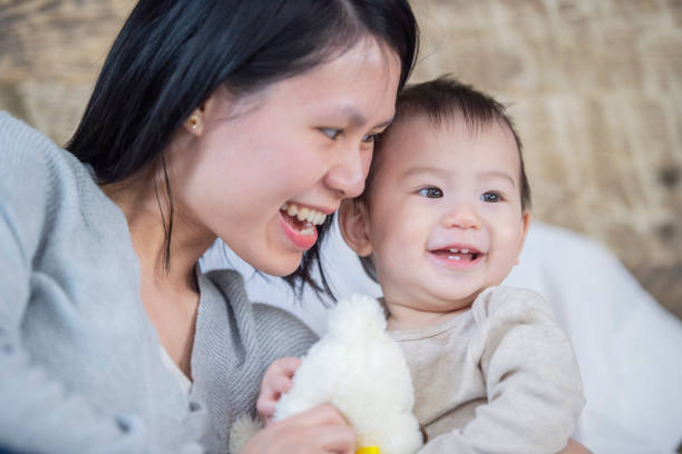 istock Mother tickling her baby 1094270160