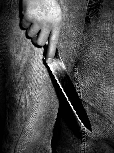 istock A male hand holding a knife 1094275382