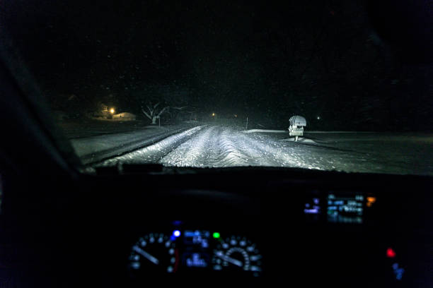 istock Winter Night Driving Through Extremely Deep Blizzard Snow Trenches 1094285660