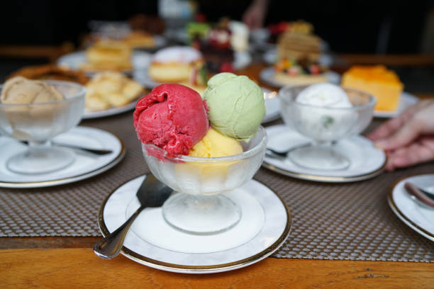 istock A bowl of ice cream scoops of various flavored, including raspberry, mango and matcha green tea flavours on blurred background. 1094288740