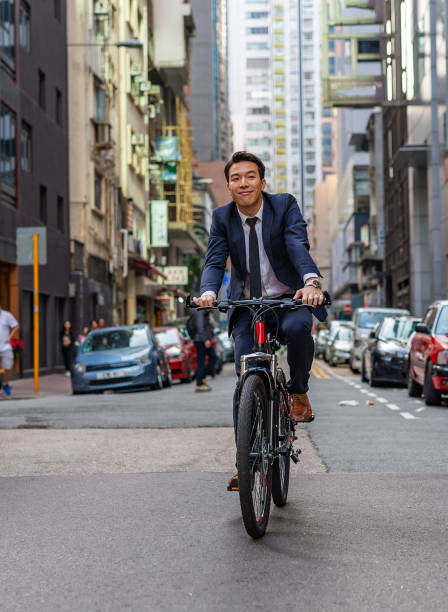 istock Asian Businessman Commuting to Work Riding a Bicycle 1094288874