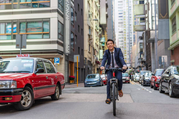 istock Asian Businessman Commuting to Work Riding a Bicycle 1094288882