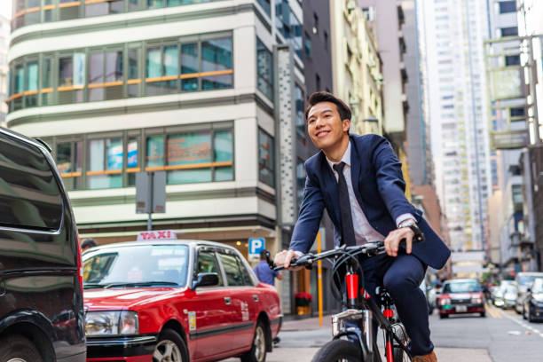 istock Asian Businessman Commuting to Work Riding a Bicycle 1094288894