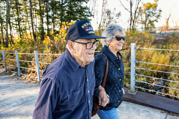 WWII USA Military War Veteran Father and Daughter Walking stock photo
