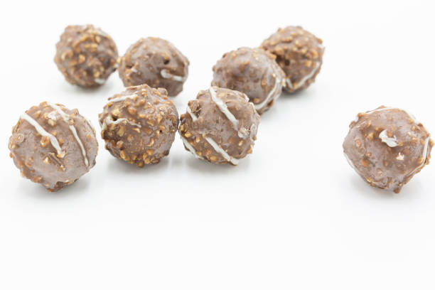 istock Chocolate ball isolated on white background, Sugared hazelnut dragees in chocolate. 1094293762