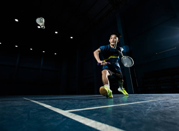 istock Asian badminton player is hitting in court 1094296242