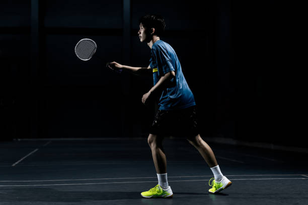istock Asian badminton player is hitting in court 1094297422