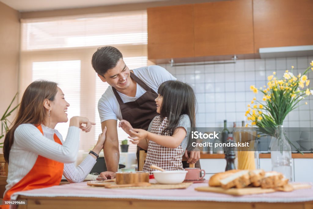 Family Daughter and parent preparing the bake Daughter help parent preparing the bake  Family concept. Family Stock Photo