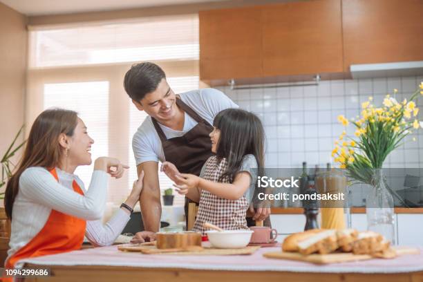 Family Daughter And Parent Preparing The Bake Stock Photo - Download Image Now - Family, Asia, Asian and Indian Ethnicities