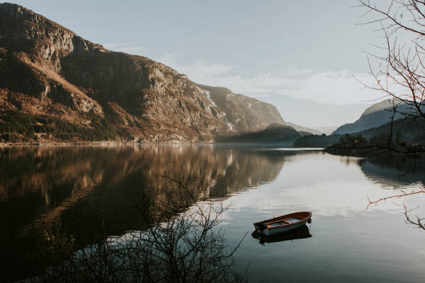 istock Tiny boat on still waters in Fjaerland, Norway 1094299818