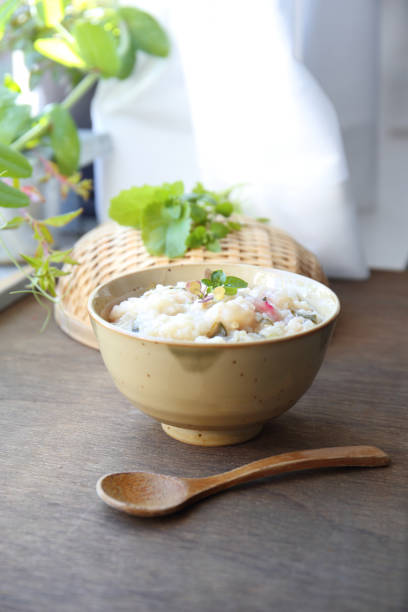 istock japanese rice congee with herbs and green vegetables 1094300376