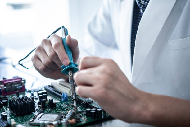 istock Researchers who repairs electronic parts. 1094303512