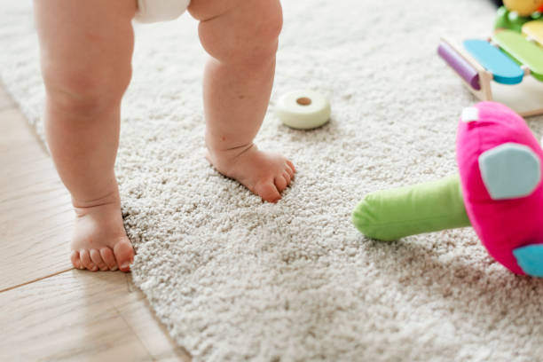 Closeup of baby's legs while standing