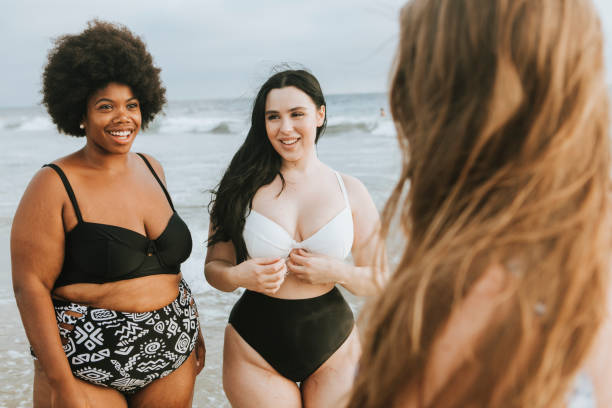 istock Cheerful beautiful plus size women at the beach 1094306958
