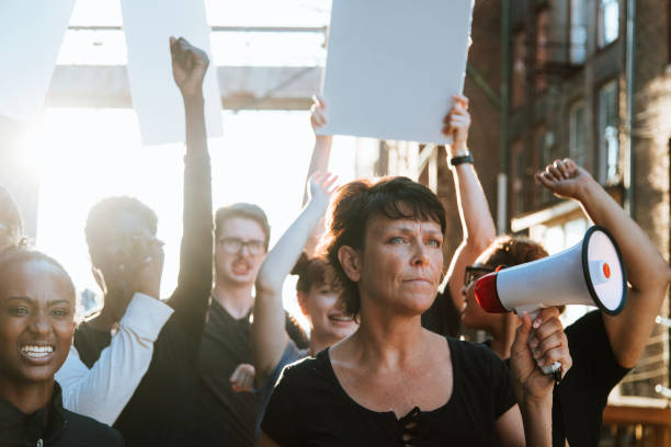 istock Feminist with a megaphone at a protest 1094309188