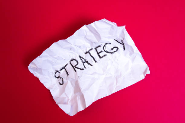 istock Word Strategy written on Crumpled paper on red background 1094312446