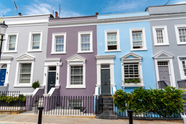 Colorful row houses Colorful row houses seen in Notting Hill, London kensington and chelsea photos stock pictures, royalty-free photos & images