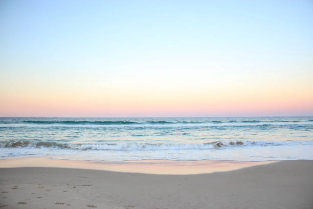 sea horizon ocean tropical summer pink sky stock photo