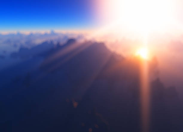 istock God rays at mountain valley bokeh background 1094318418