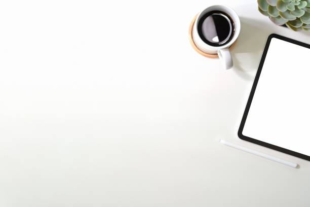 istock Mockup blank screen tablet with coffee on office desk 1094324488