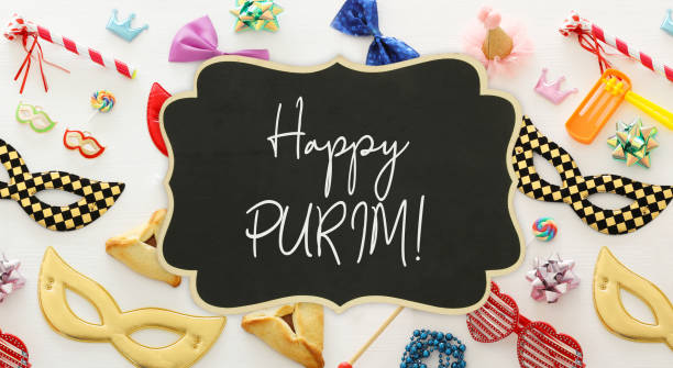 istock Purim celebration concept (jewish carnival holiday) over wooden white background. 1094329594