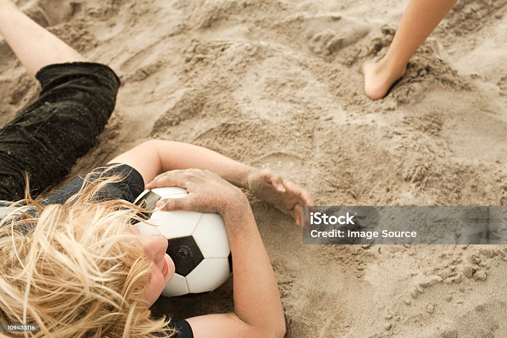 Boys on beach with football - 로열티 프리 하이 앵글 스톡 사진