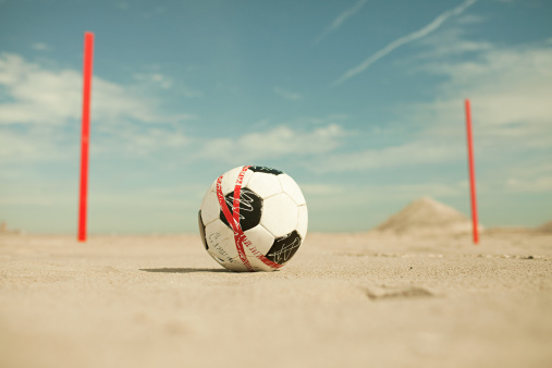 soccer ball on the sand