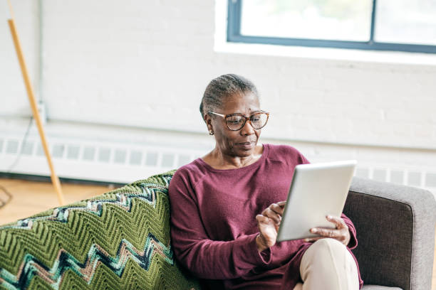istock Senior women at home using tablet 1094334450