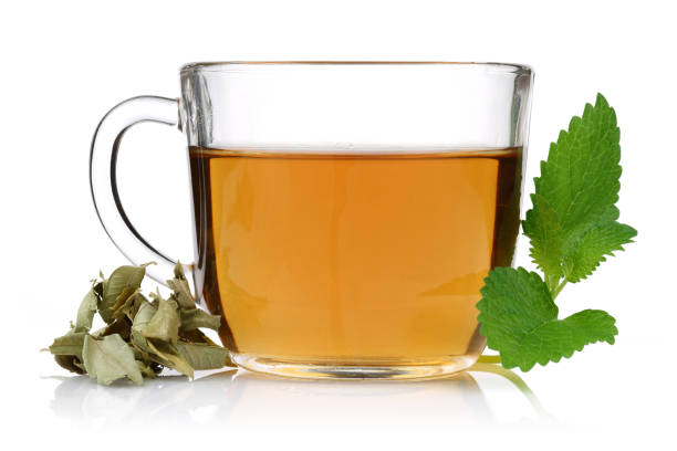 istock Lemon balm tea in glass cup with lemon balm leaves 1094340340