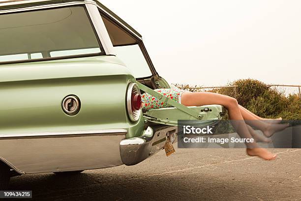 Two Girls Lying In Estate Car Stock Photo - Download Image Now - Retro Style, Road Trip, 1950-1959