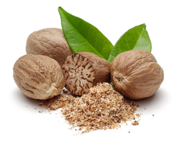 istock Nutmeg granules and nutmegs with leaves 1094343298