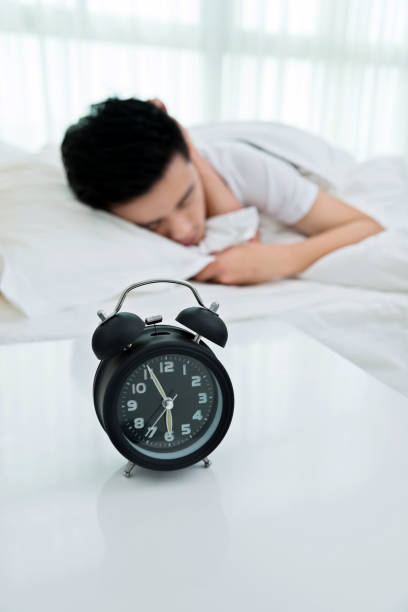 istock Young man asleep in bed 1094346276
