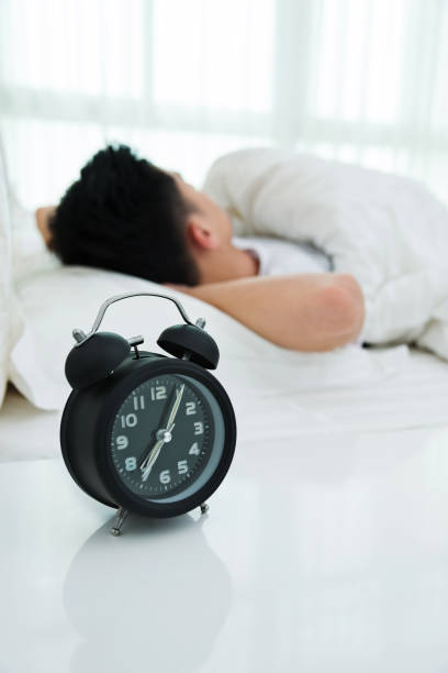 istock Young man asleep in bed 1094346346