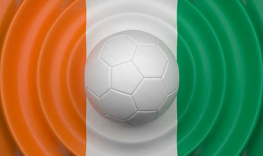 Cote d'lvoire, soccer ball on a wavy background, complementing the composition in the form of a flag, 3d illustration