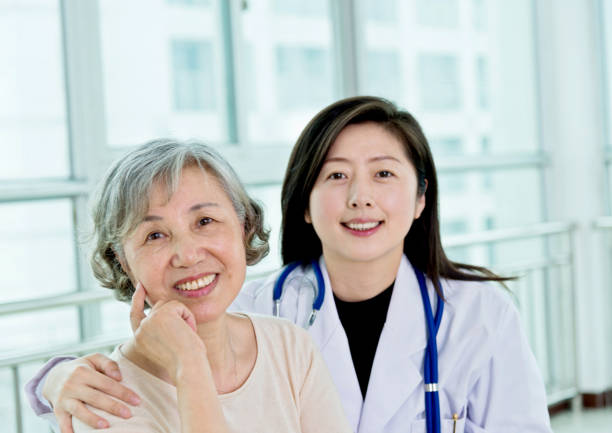 istock Female doctor with senior patient 1094351406