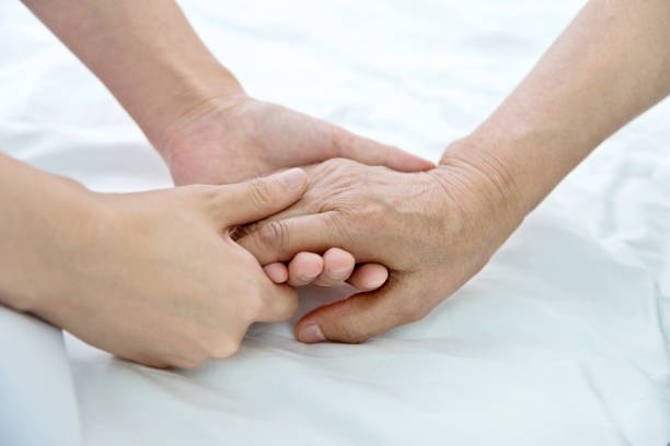 istock Young hands holding a senior woman's hands 1094351656