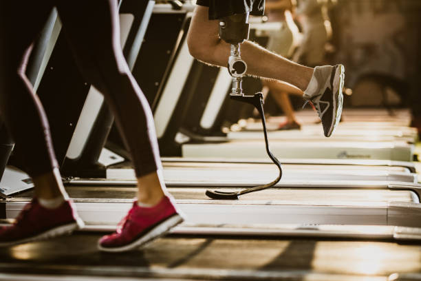 istock Unrecognizable amputee exercising on treadmill in a gym. 1094354504