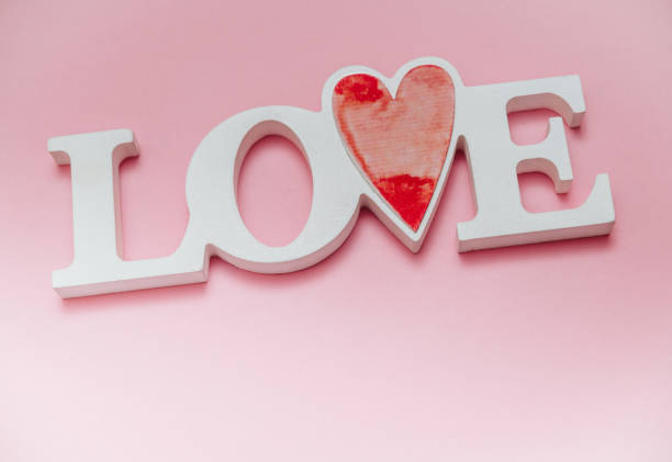 istock Single word LOVE with wooden hearts 1094354834