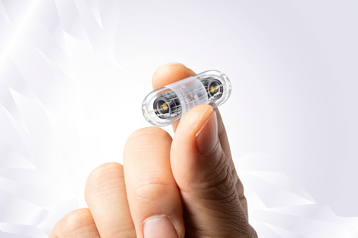 Human hand and small capsule endoscope