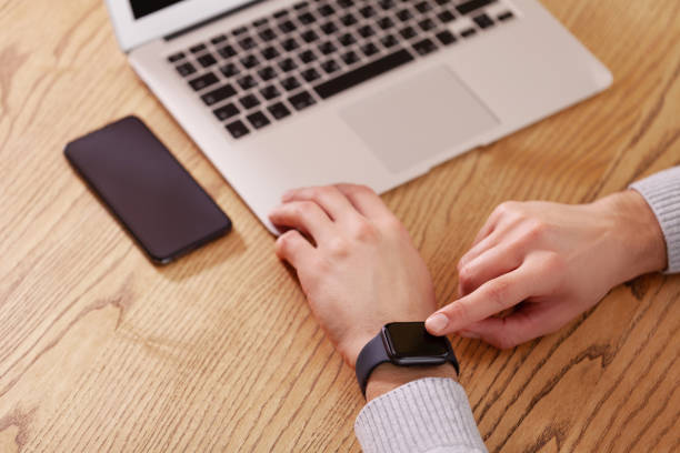 istock Men's hand touching smart watch on top view. Can be used as mock up 1094355734