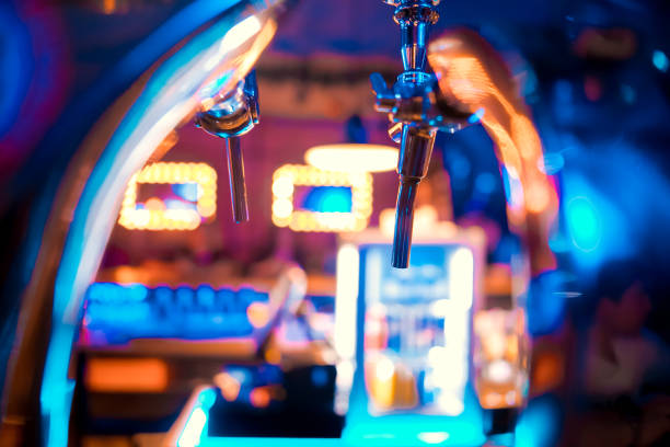 istock Bartender pouring from tap fresh beer into the glass in pub 1094357230