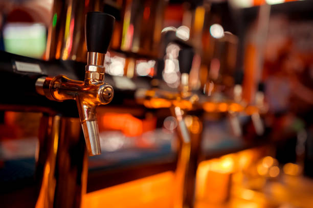 istock Bartender pouring from tap fresh beer into the glass in pub 1094357272