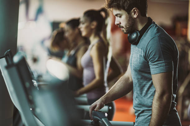 istock Young athlete about to start exercising on treadmill in a gym. 1094357634