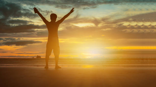 istock Freedom traveller hold the hand on beach sunset 1094362324
